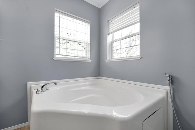 7320 Partridge Dr, Dublin, OH 43016 - full bathroom with a garden tub and a healthy amount of sunlight