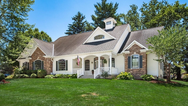 87 Dartmouth Rd SE, Hebron, OH 43025 - view of front of house featuring covered porch, a shingled roof, and stone siding