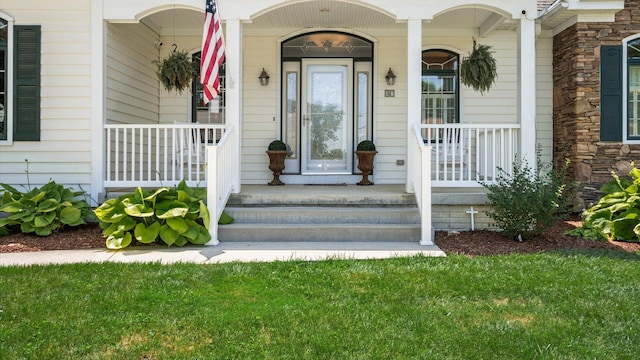 87 Dartmouth Rd SE, Hebron, OH 43025 - property entrance featuring stone siding and covered porch