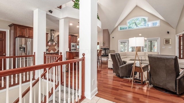 87 Dartmouth Rd SE, Hebron, OH 43025 - living area with light wood-style flooring and vaulted ceiling