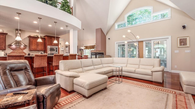 87 Dartmouth Rd SE, Hebron, OH 43025 - living area with high vaulted ceiling and light wood-style floors
