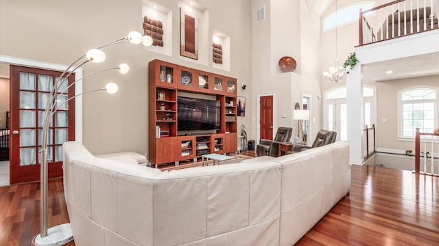 87 Dartmouth Rd SE, Hebron, OH 43025 - living room with a high ceiling, visible vents, french doors, and wood finished floors
