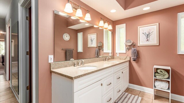 87 Dartmouth Rd SE, Hebron, OH 43025 - bathroom featuring a sink, double vanity, baseboards, recessed lighting, and tile patterned flooring