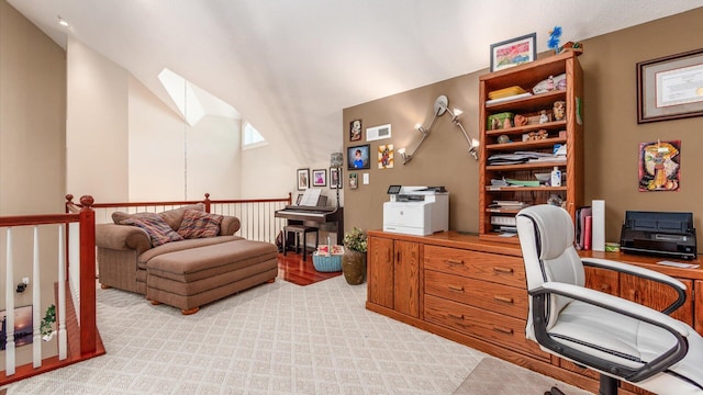 87 Dartmouth Rd SE, Hebron, OH 43025 - office featuring visible vents, vaulted ceiling with skylight, and light colored carpet