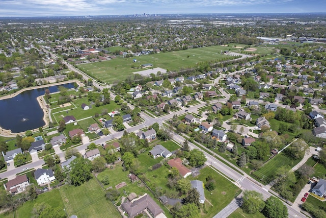 drone / aerial view featuring a water view and a residential view