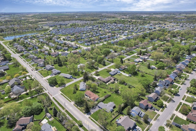 aerial view featuring a residential view and a water view
