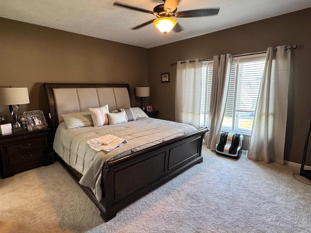 bedroom featuring a ceiling fan and light carpet