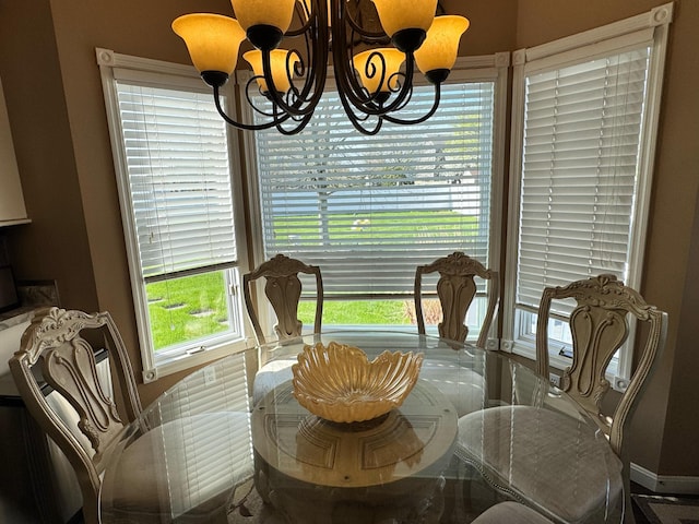dining area featuring a notable chandelier