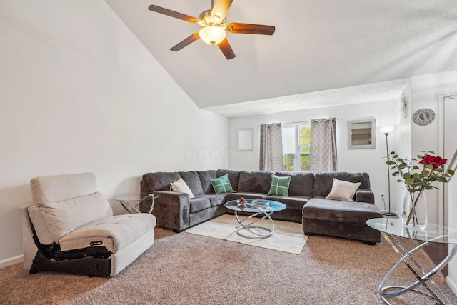 living room with lofted ceiling, ceiling fan, and carpet floors