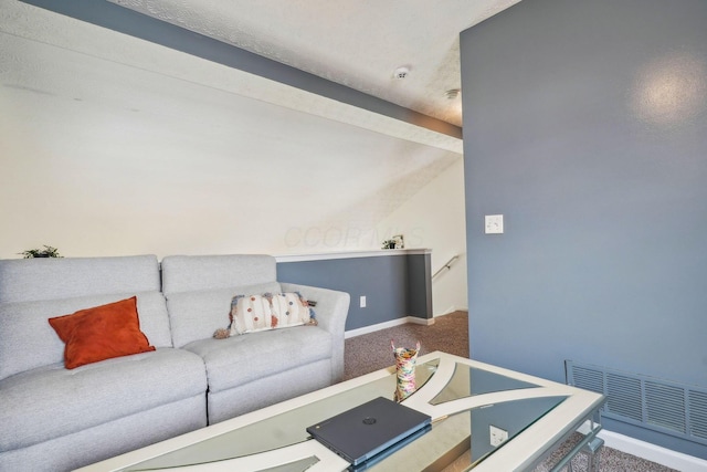 living room featuring lofted ceiling, carpet, visible vents, and baseboards