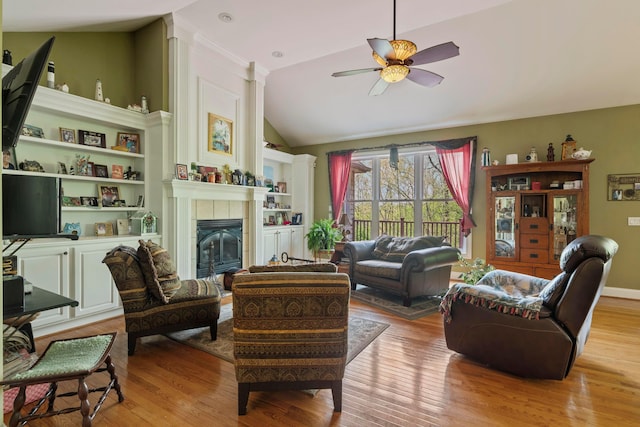 4611 Meghans Run, Batavia, OH 45103 - living area featuring a ceiling fan, vaulted ceiling, light wood-style flooring, and a fireplace