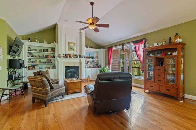 4611 Meghans Run, Batavia, OH 45103 - living room with ceiling fan, wood finished floors, vaulted ceiling, and a tile fireplace