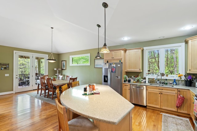 4611 Meghans Run, Batavia, OH 45103 - kitchen featuring a kitchen island, light wood-style floors, a sink, hanging light fixtures, and stainless steel appliances