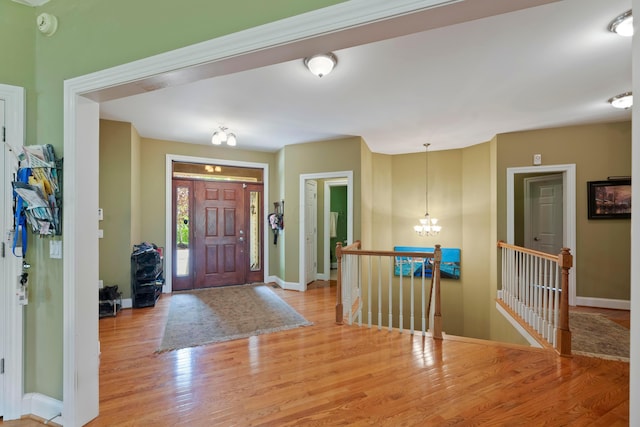 4611 Meghans Run, Batavia, OH 45103 - foyer featuring baseboards, wood finished floors, and a chandelier
