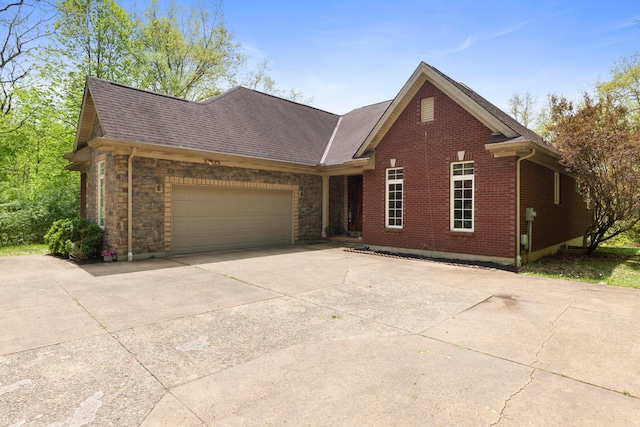 4611 Meghans Run, Batavia, OH 45103 - ranch-style house featuring a shingled roof, an attached garage, driveway, and brick siding