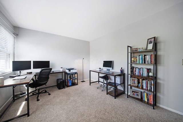 home office with carpet floors and baseboards