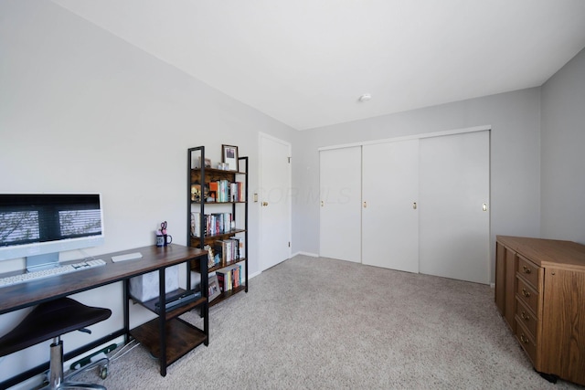 office area featuring light carpet