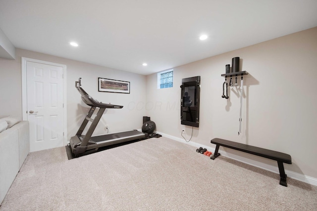 exercise area featuring carpet floors, baseboards, and recessed lighting