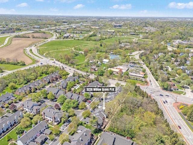 birds eye view of property with a residential view