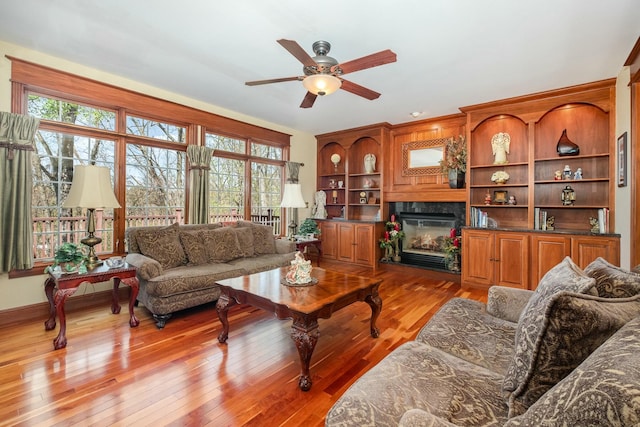 1917 Nichole Cir, Lancaster, OH 43130 - living area with a ceiling fan, a high end fireplace, and light wood finished floors