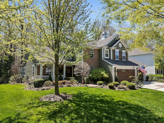 6767 Burnside Ln, Dublin, OH 43016 - view of front of house with driveway, a front yard, and a garage