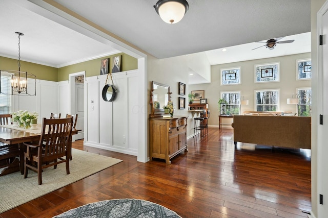 6767 Burnside Ln, Dublin, OH 43016 - dining space featuring recessed lighting, ceiling fan with notable chandelier, a decorative wall, and dark wood finished floors
