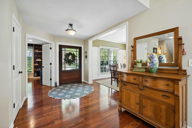 6767 Burnside Ln, Dublin, OH 43016 - foyer entrance featuring dark wood finished floors and baseboards