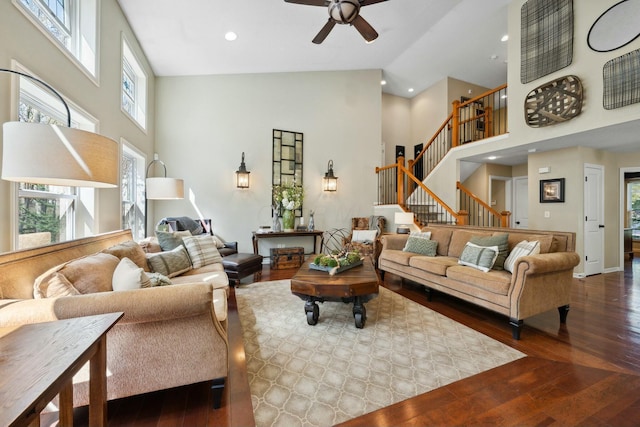 6767 Burnside Ln, Dublin, OH 43016 - living room with hardwood / wood-style flooring, a ceiling fan, recessed lighting, and a high ceiling