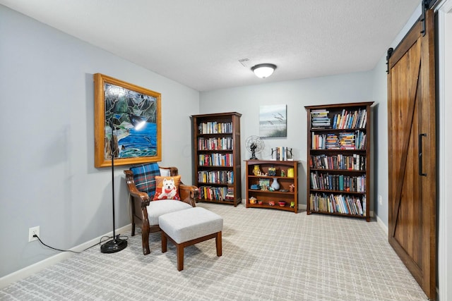 6767 Burnside Ln, Dublin, OH 43016 - living area featuring a textured ceiling, a barn door, baseboards, and carpet floors