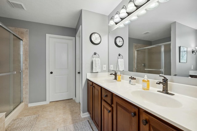 6767 Burnside Ln, Dublin, OH 43016 - full bath featuring a sink, a shower stall, and visible vents