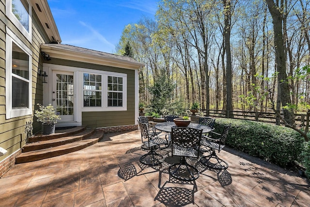 6767 Burnside Ln, Dublin, OH 43016 - view of patio / terrace with outdoor dining area, entry steps, and fence