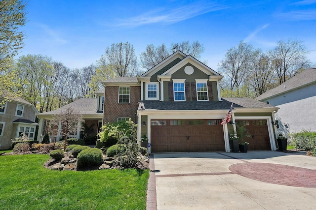6767 Burnside Ln, Dublin, OH 43016 - view of front of property featuring brick siding, a shingled roof, a front yard, concrete driveway, and an attached garage