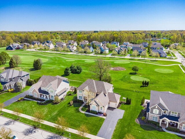 bird's eye view featuring view of golf course and a residential view
