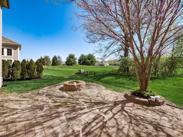 view of patio / terrace featuring a fire pit