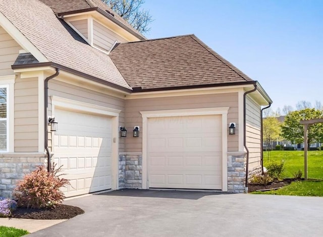 garage featuring driveway