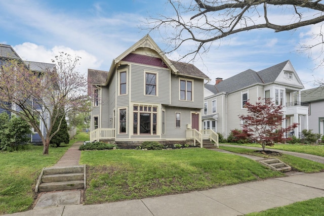 423 Hudson Ave, Newark, OH 43055 - victorian-style house featuring a front lawn