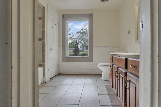 423 Hudson Ave, Newark, OH 43055 - full bathroom featuring visible vents, a wainscoted wall, toilet, tile patterned floors, and vanity