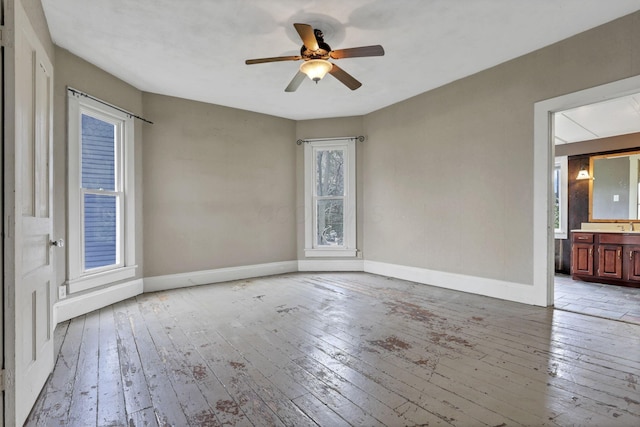 423 Hudson Ave, Newark, OH 43055 - unfurnished room featuring baseboards, a ceiling fan, and light wood-style floors