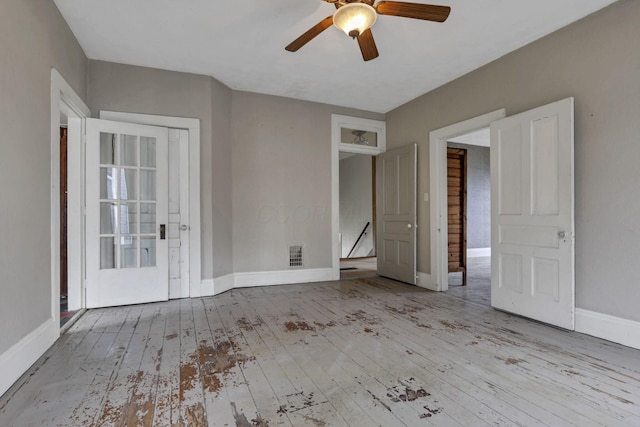 423 Hudson Ave, Newark, OH 43055 - unfurnished room with baseboards, visible vents, a ceiling fan, and wood-type flooring