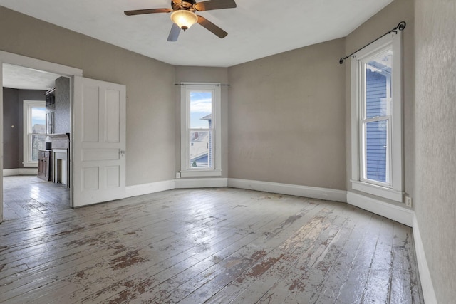423 Hudson Ave, Newark, OH 43055 - unfurnished room with baseboards, hardwood / wood-style flooring, and ceiling fan