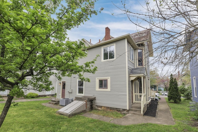 423 Hudson Ave, Newark, OH 43055 - back of house with a chimney and a yard
