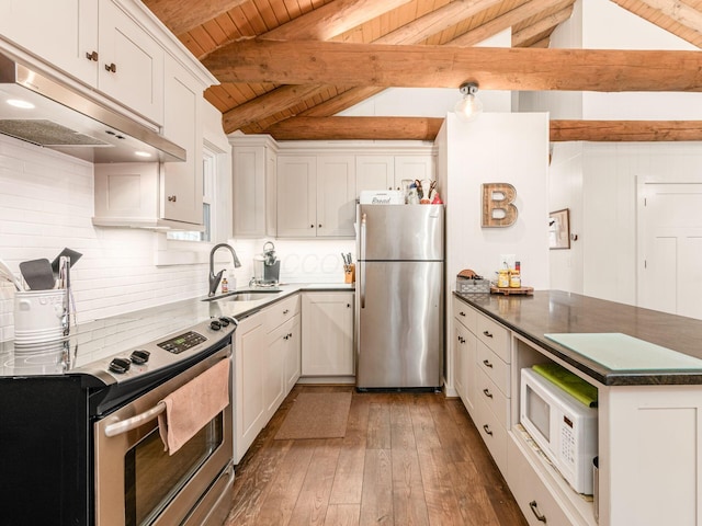 kitchen with wood ceiling, appliances with stainless steel finishes, a sink, vaulted ceiling with beams, and under cabinet range hood