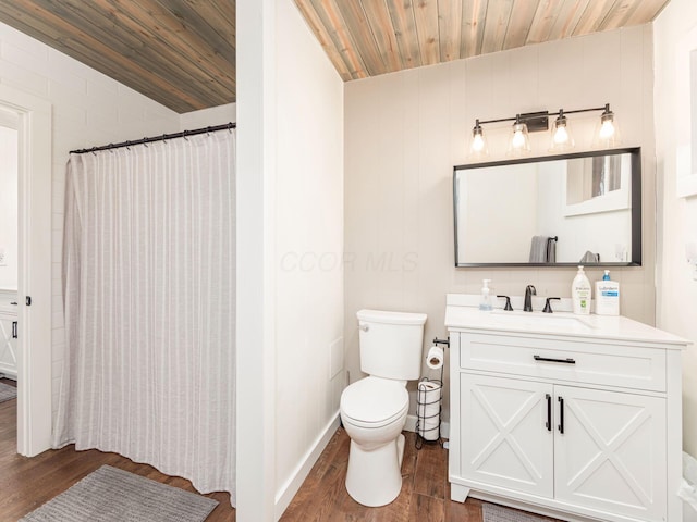 bathroom featuring wooden ceiling, vanity, and wood finished floors
