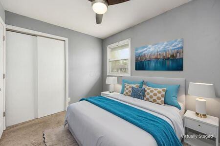 bedroom featuring a closet, carpet flooring, and a ceiling fan