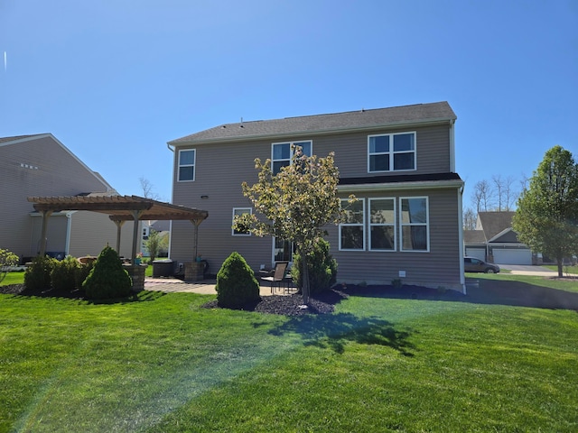 rear view of property with a pergola, a lawn, and a patio area