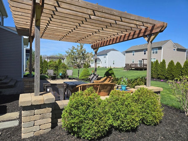 view of patio / terrace with a pergola and a residential view