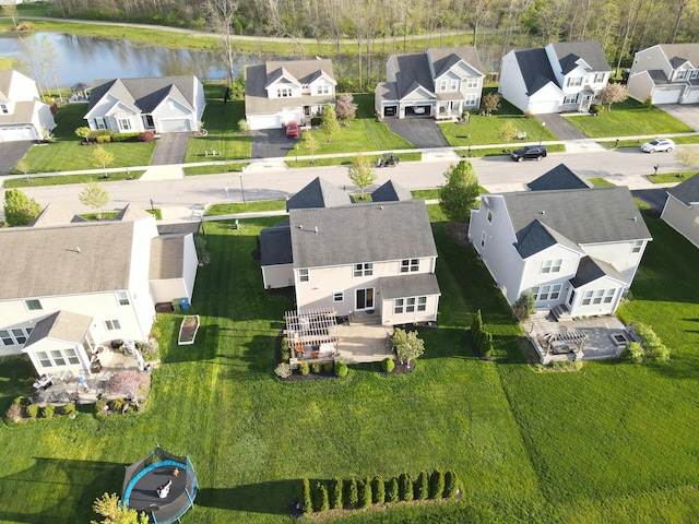 aerial view with a residential view and a water view