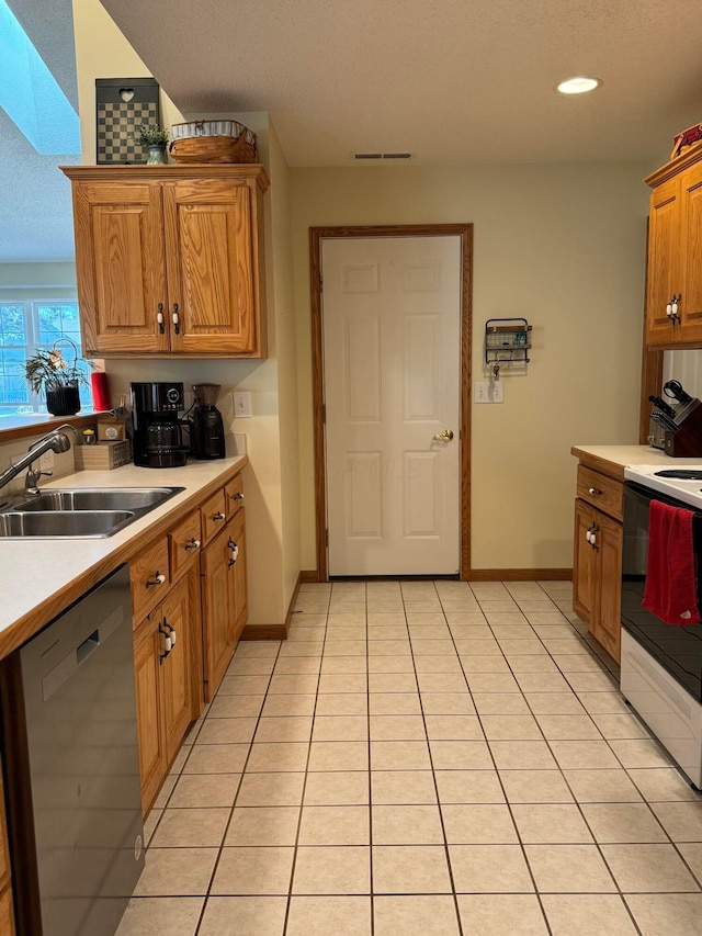 kitchen featuring light countertops, white electric range oven, a sink, and dishwasher