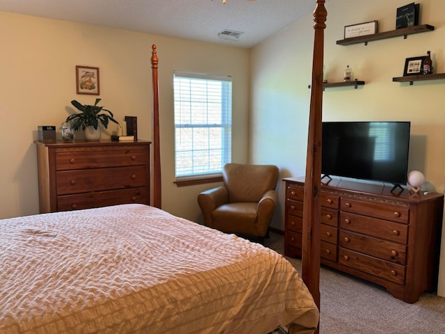 carpeted bedroom with visible vents