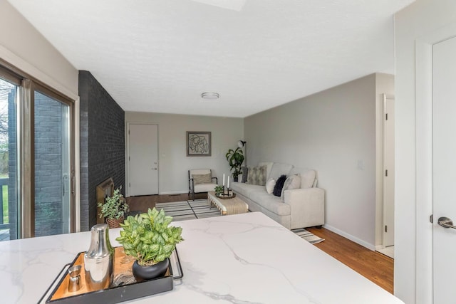 bedroom featuring baseboards and wood finished floors